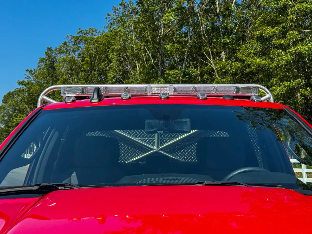 Front wheel and tire close-up showing tread pattern and fender flare.